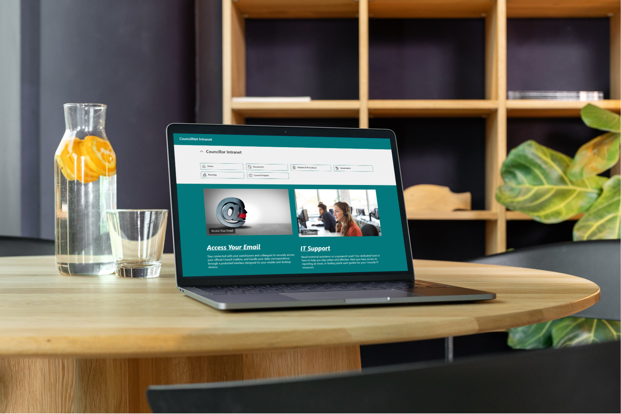 image of a Laptop sitting on a desk showing CouncilNet Intranet Solution.